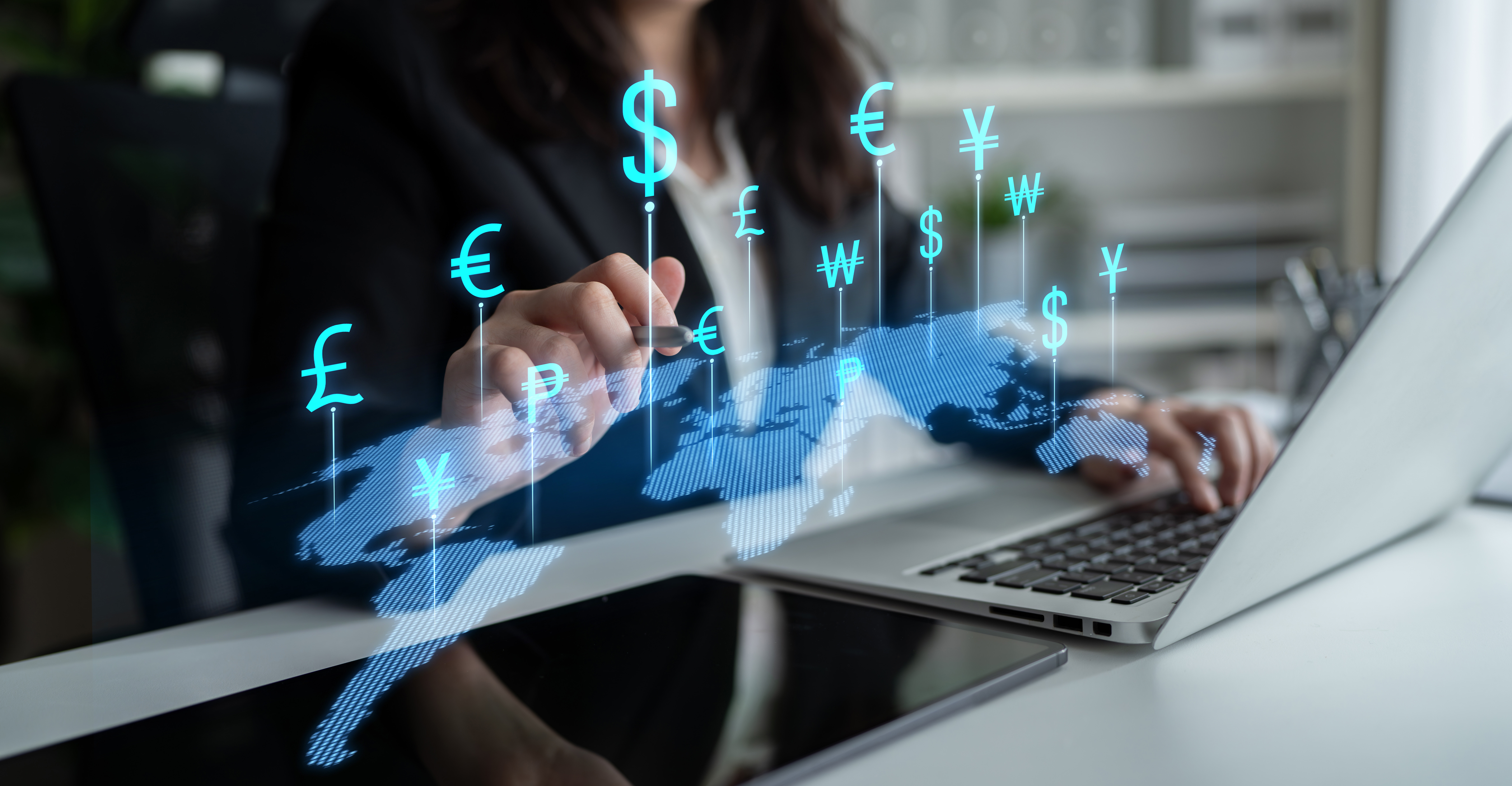 Business professional uses a laptop to engage with a digital currency exchange illustration, showcasing modern finance technology in a lively office setting.